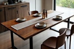 Rustic-industrial dining table with steel legs made from reclaimed wood