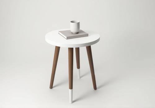 After: A sleek, two-tone painted accent table, a stunning example of vintage furniture upcycling.